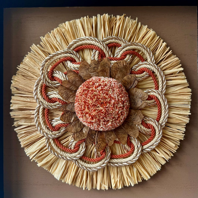 Close up of a colourful passementerie rosette with natural materials